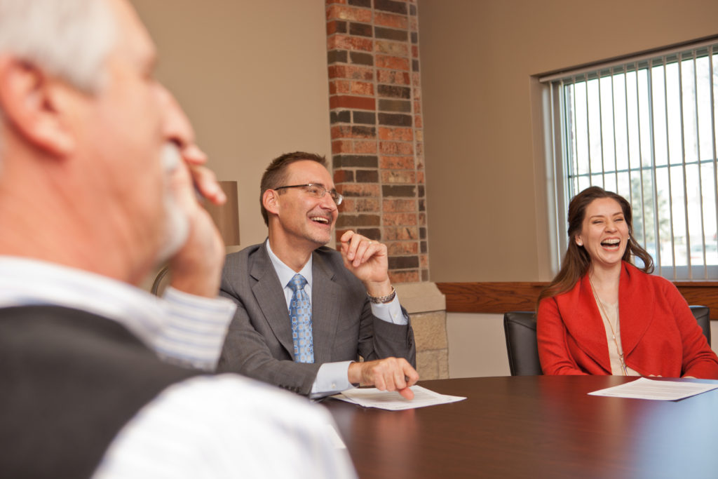 A group of people sitting at a table.